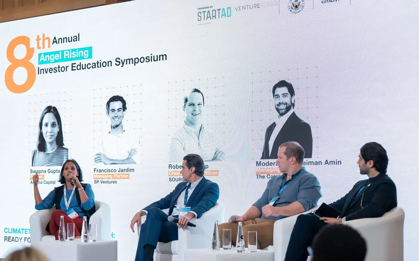 A four-person panel on stage at the eighth annual Angel Rising Investor Education Symposium.